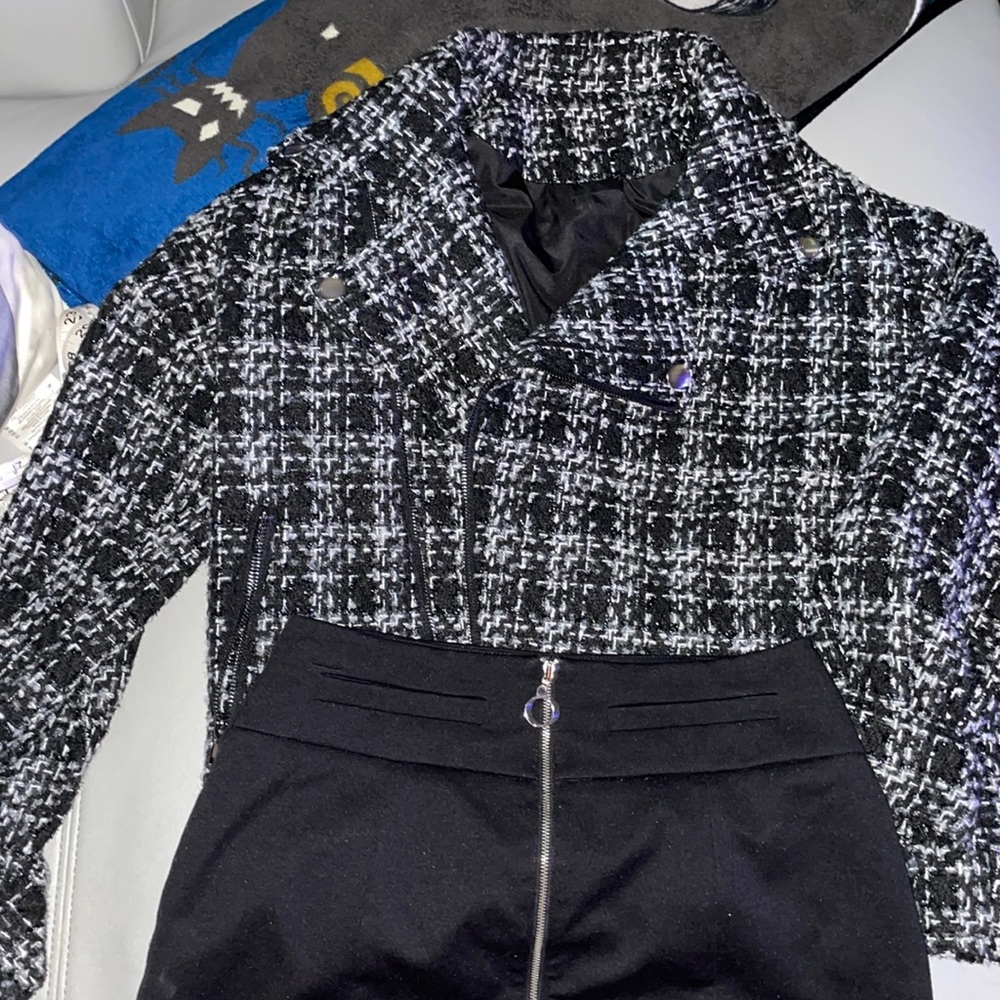 Black and white moto style jacket.